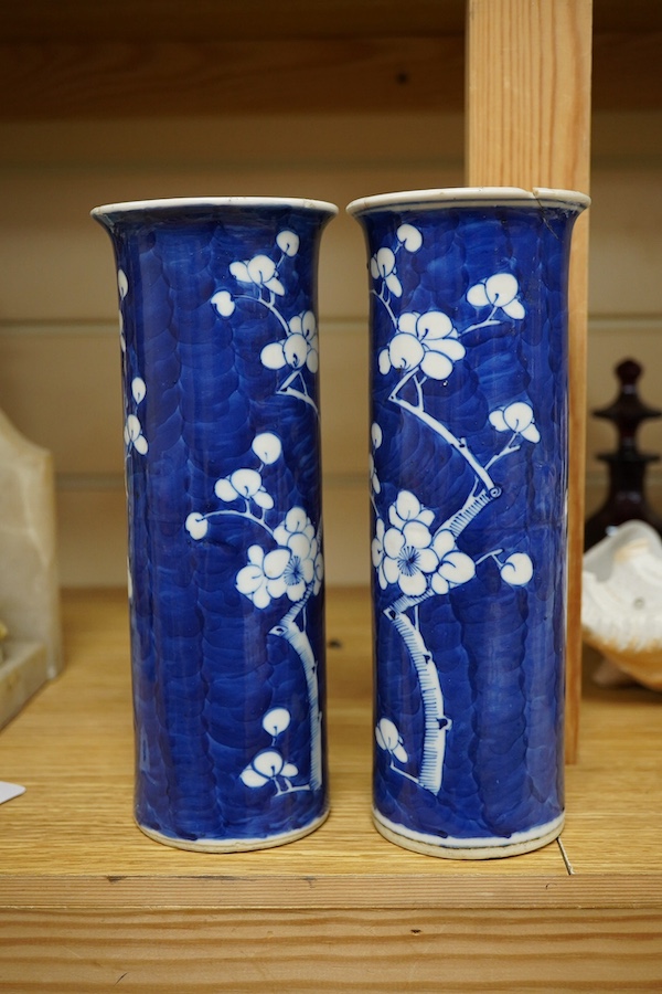 A pair of Chinese prunus flower sleeve vases, 21cm high. Condition - cracked